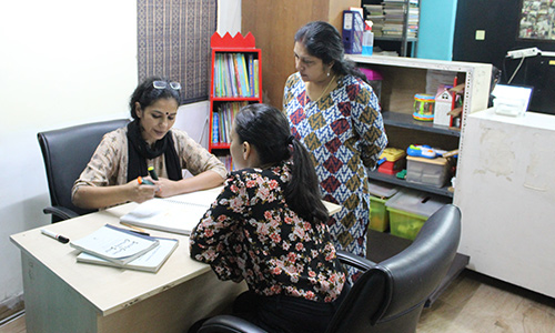 Indian mother and young child sitting together warmly, representing the importance of early intervention for autism in India